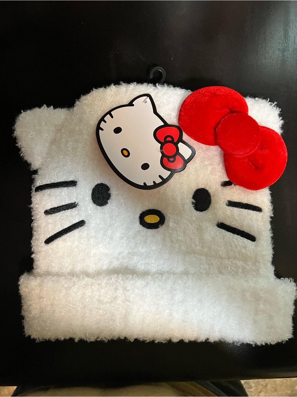 Sanrio Hello Kitty fuzzy white beanie hat with 3D red bow. OSFM